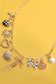 CHARM NECKLACE-BOW CHECKER HEART FLORAL: GOLD