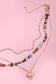 MULTI LAYERED BEADED HEART CHARM NECKLACE